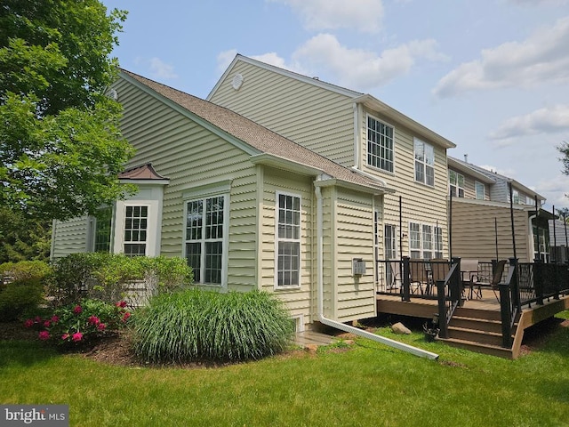 11 Musket Ct Unit 53, West Chester, PA 19380 - rear view of house featuring a deck, a yard, and roof with shingles