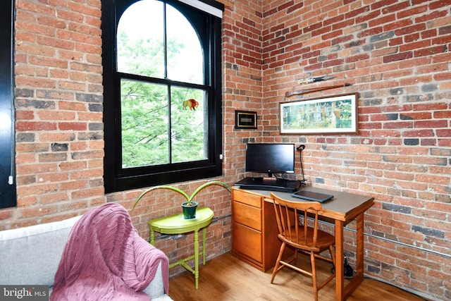 57 N St NW Unit 301, Washington, DC 20001 - office area featuring plenty of natural light, brick wall, and light wood-style floors