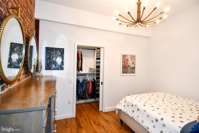 57 N St NW Unit 301, Washington, DC 20001 - bedroom with a chandelier, wood finished floors, a closet, and a walk in closet