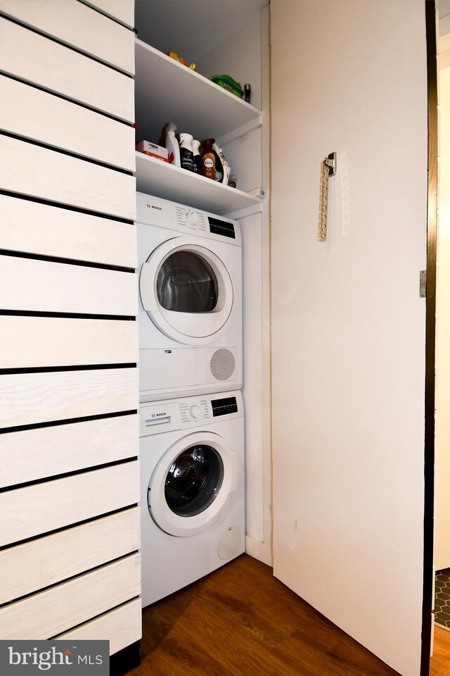 57 N St NW Unit 301, Washington, DC 20001 - laundry area with estacked washer and dryer and dark wood finished floors