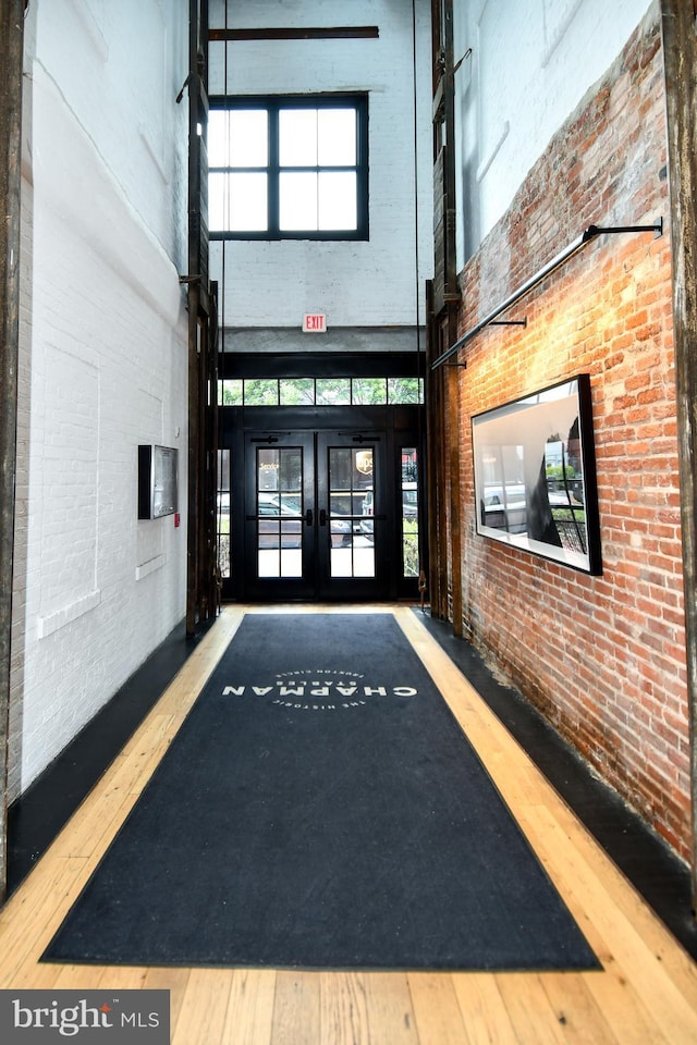 57 N St NW Unit 301, Washington, DC 20001 - common area with a towering ceiling and brick wall