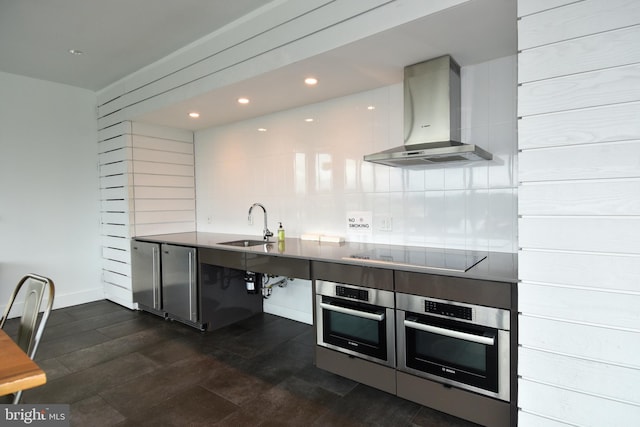 57 N St NW Unit 301, Washington, DC 20001 - kitchen featuring wall chimney range hood, stainless steel oven, black electric stovetop, tasteful backsplash, and recessed lighting