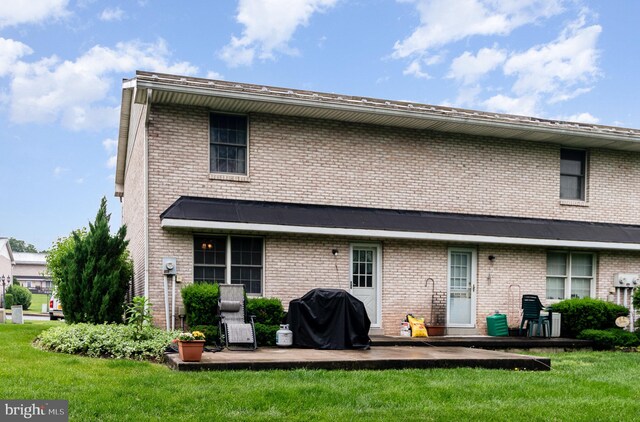 11 Bentley Pl, Carlisle, PA 17013 - rear view of property with a yard, brick siding, and a patio area