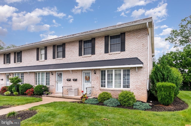 11 Bentley Pl, Carlisle, PA 17013 - view of front facade with a front lawn and brick siding