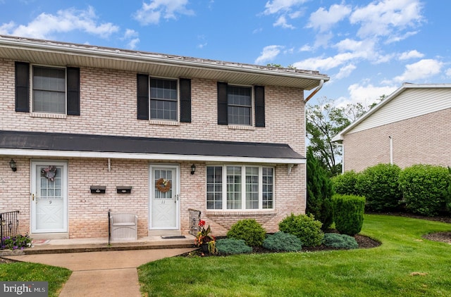 11 Bentley Pl, Carlisle, PA 17013 - view of front of house with a front yard and brick siding