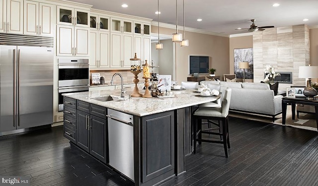 2022 Saint James Rd, Accokeek, MD 20607 - kitchen with stainless steel appliances, ceiling fan, ornamental molding, dark wood-style floors, and open floor plan