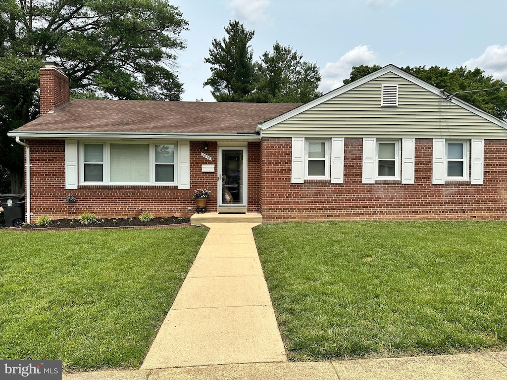 2010 Jameson St, Temple Hills, MD 20748 - ranch-style home featuring a chimney, brick siding, a front lawn, and a shingled roof