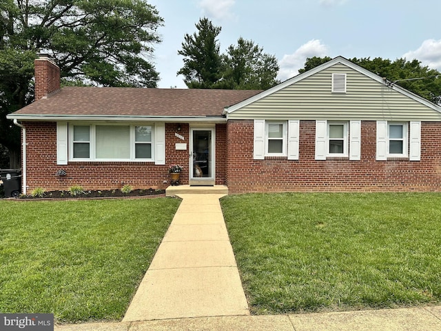 2010 Jameson St, Temple Hills, MD 20748 - ranch-style home featuring a chimney, brick siding, a front lawn, and a shingled roof