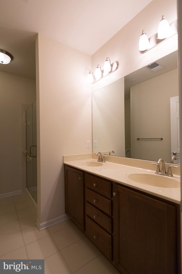 1115 Halifax Pl, Hamilton, NJ 08619 - bathroom with tile patterned flooring, double vanity, a shower stall, and baseboards