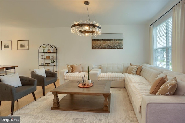 524 Charles Ave, Hanover, PA 17331 - living room with healthy amount of natural light, a chandelier, and light wood-type flooring