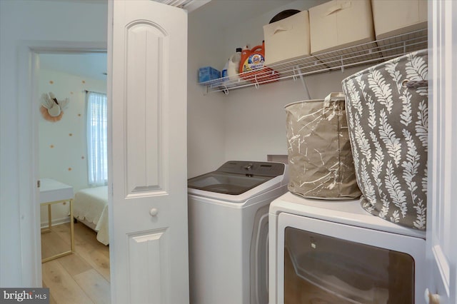 524 Charles Ave, Hanover, PA 17331 - laundry room with wood finished floors and separate washer and dryer