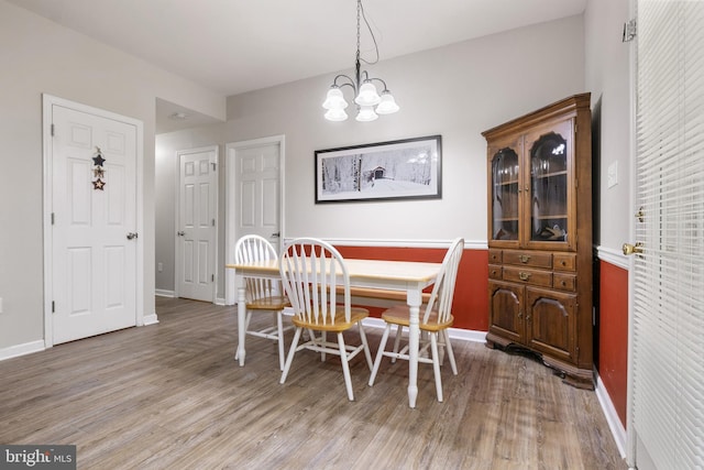 104 Beverly Blvd, Fayetteville, PA 17222 - dining area featuring light wood finished floors, a chandelier, and baseboards