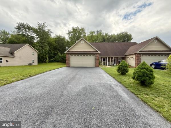 104 Beverly Blvd, Fayetteville, PA 17222 - ranch-style home with an attached garage, driveway, a front yard, and brick siding