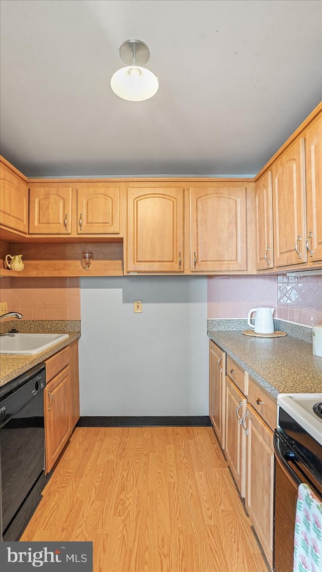 28 Allegheny Ave Unit 2505, Baltimore, MD 21204 - kitchen featuring black dishwasher, tasteful backsplash, light wood-type flooring, and a sink