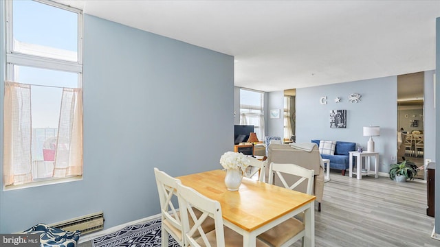 28 Allegheny Ave Unit 2505, Baltimore, MD 21204 - dining room featuring light wood-style flooring and baseboards
