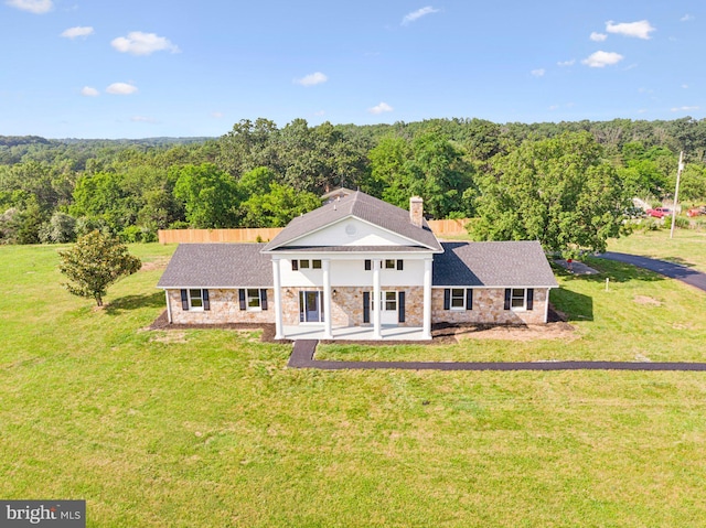 977 W Parkins Mill Rd, Winchester, VA 22602 - greek revival house featuring a wooded view, stone siding, and a shingled roof