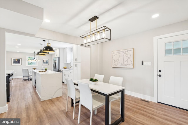 977 W Parkins Mill Rd, Winchester, VA 22602 - dining space with light wood finished floors and recessed lighting