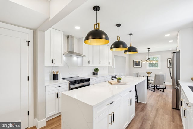 977 W Parkins Mill Rd, Winchester, VA 22602 - kitchen with wall chimney exhaust hood, black electric range oven, a center island, white cabinetry, and recessed lighting