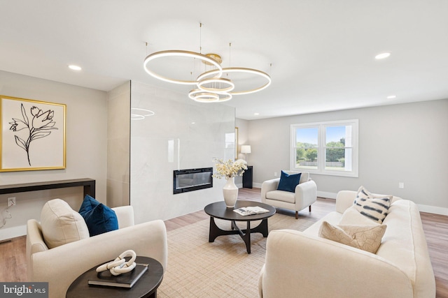 977 W Parkins Mill Rd, Winchester, VA 22602 - living room featuring wood finished floors, a fireplace, a chandelier, and recessed lighting