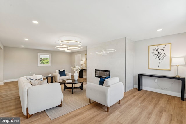 977 W Parkins Mill Rd, Winchester, VA 22602 - living room featuring light wood-type flooring, recessed lighting, a chandelier, and a fireplace