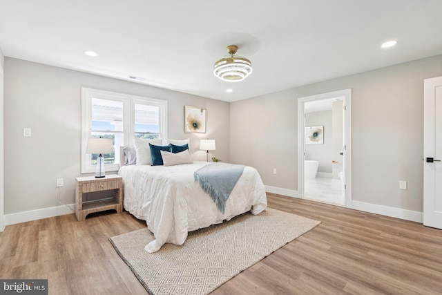 977 W Parkins Mill Rd, Winchester, VA 22602 - bedroom with light wood finished floors, recessed lighting, and connected bathroom