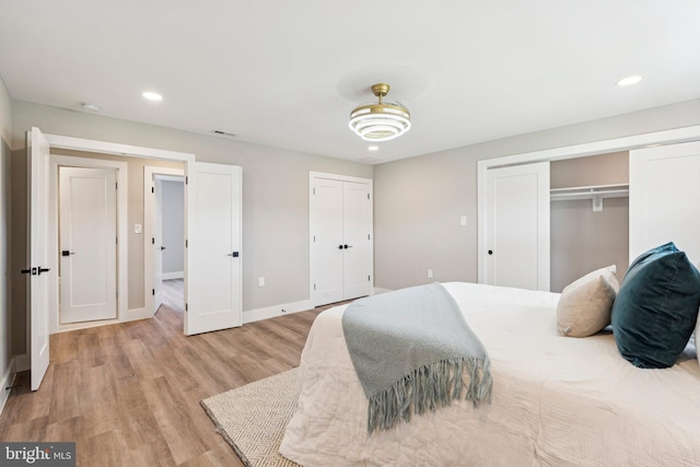 977 W Parkins Mill Rd, Winchester, VA 22602 - bedroom with two closets, light wood-style floors, and recessed lighting