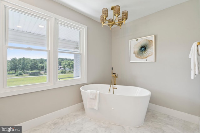 977 W Parkins Mill Rd, Winchester, VA 22602 - full bathroom featuring a chandelier, marble look tile flooring, and a freestanding bath