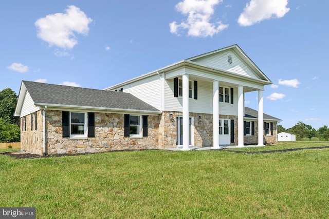 977 W Parkins Mill Rd, Winchester, VA 22602 - neoclassical / greek revival house featuring stone siding, a front yard, a porch, and roof with shingles