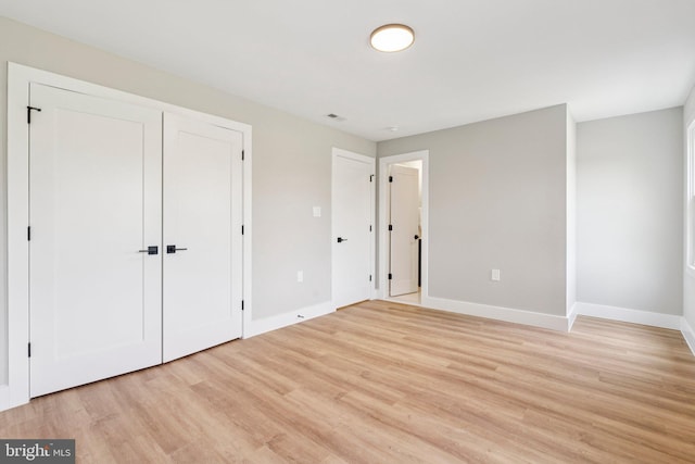 977 W Parkins Mill Rd, Winchester, VA 22602 - unfurnished bedroom with light wood-type flooring and a closet
