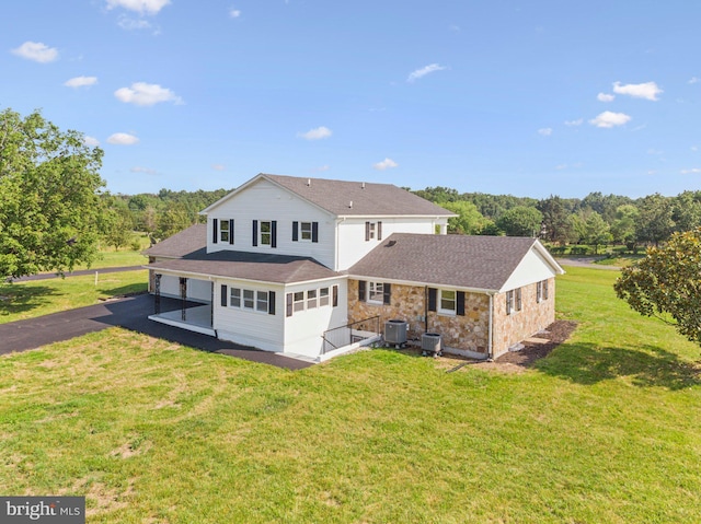 977 W Parkins Mill Rd, Winchester, VA 22602 - rear view of house with a yard, roof with shingles, driveway, and a garage