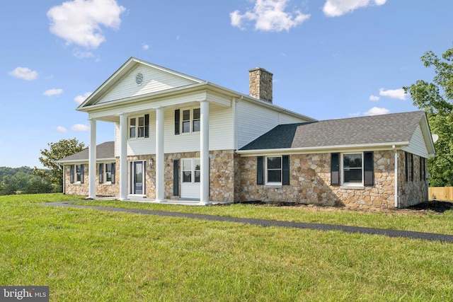 977 W Parkins Mill Rd, Winchester, VA 22602 - view of front of house featuring stone siding, a chimney, and a front lawn