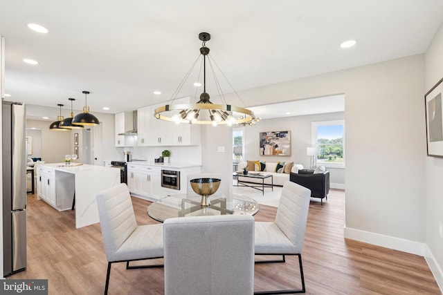 977 W Parkins Mill Rd, Winchester, VA 22602 - dining area with a chandelier, light wood-style flooring, and recessed lighting