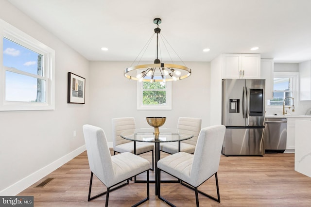 977 W Parkins Mill Rd, Winchester, VA 22602 - dining room featuring a chandelier, light wood-style flooring, and recessed lighting