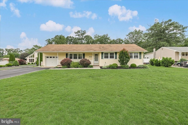 12 Woodlawn Ave, Newfield, NJ 08344 - ranch-style house with a garage, driveway, and a front yard