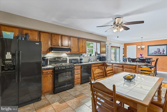 12 Woodlawn Ave, Newfield, NJ 08344 - kitchen with black appliances, under cabinet range hood, brown cabinets, backsplash, and a peninsula