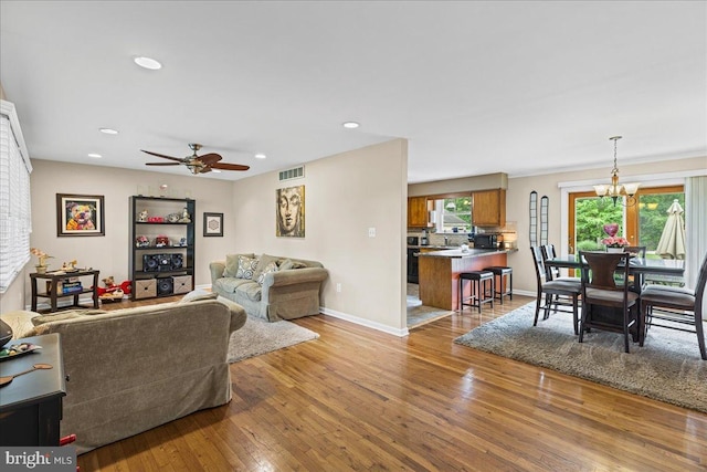 12 Woodlawn Ave, Newfield, NJ 08344 - living room with hardwood / wood-style flooring, ceiling fan, a chandelier, and recessed lighting