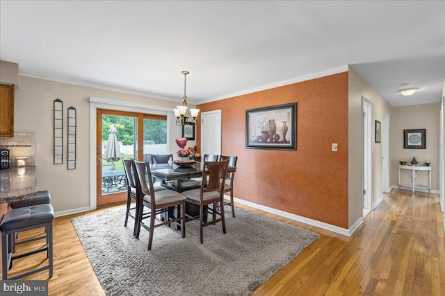 12 Woodlawn Ave, Newfield, NJ 08344 - dining area with a chandelier, light wood finished floors, and crown molding