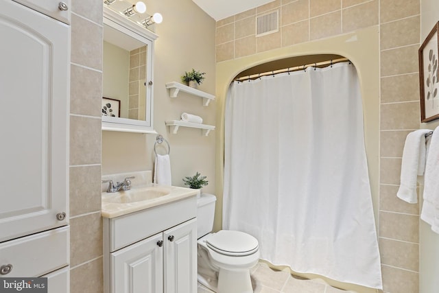 1708 Webster St, Baltimore, MD 21230 - full bath featuring vanity, a shower with shower curtain, and tile walls