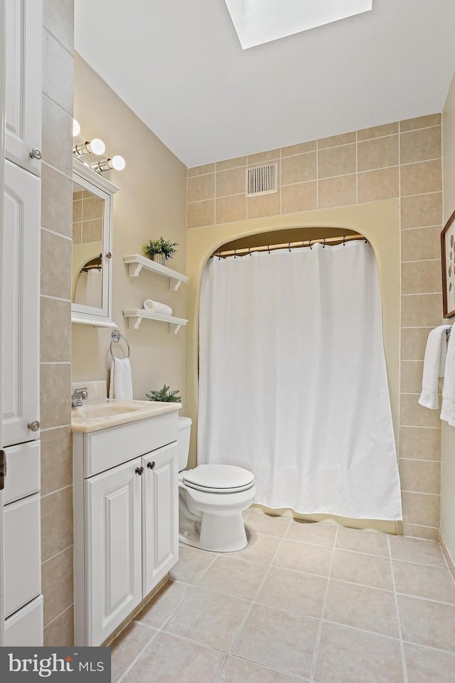 1708 Webster St, Baltimore, MD 21230 - bathroom featuring tile patterned flooring, vanity, and a shower with shower curtain
