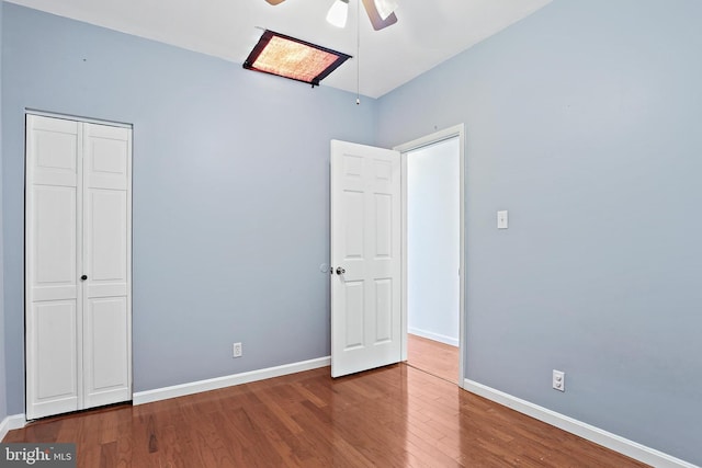 1708 Webster St, Baltimore, MD 21230 - unfurnished bedroom featuring wood finished floors, ceiling fan, and a closet