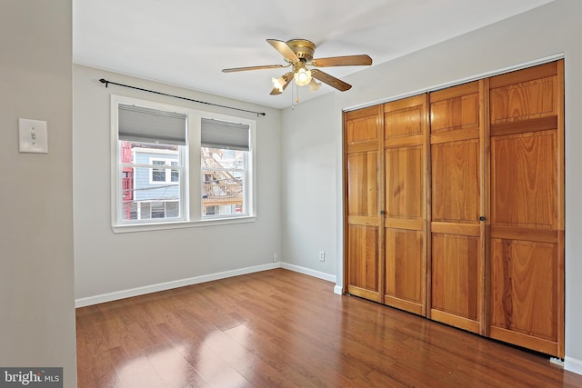 1708 Webster St, Baltimore, MD 21230 - unfurnished bedroom with dark wood finished floors, a closet, and ceiling fan