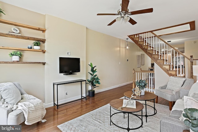 1708 Webster St, Baltimore, MD 21230 - living area featuring a ceiling fan, stairway, and wood finished floors
