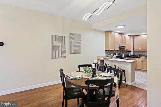 1708 Webster St, Baltimore, MD 21230 - dining area with light wood finished floors and baseboards
