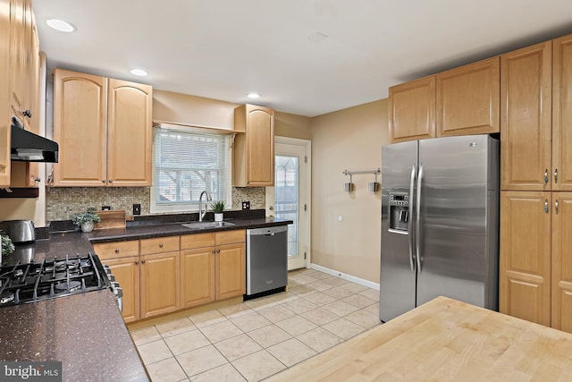 1708 Webster St, Baltimore, MD 21230 - kitchen featuring appliances with stainless steel finishes, decorative backsplash, ventilation hood, light brown cabinets, and light tile patterned flooring