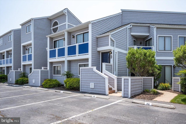 39770 E Sun Dr Unit 125, Fenwick Island, DE 19944 - view of building exterior with uncovered parking