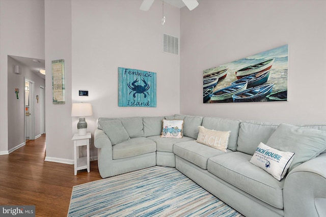 39770 E Sun Dr Unit 125, Fenwick Island, DE 19944 - living area featuring a towering ceiling, wood finished floors, and a ceiling fan