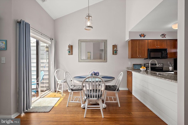 39770 E Sun Dr Unit 125, Fenwick Island, DE 19944 - dining area featuring wood finished floors and vaulted ceiling