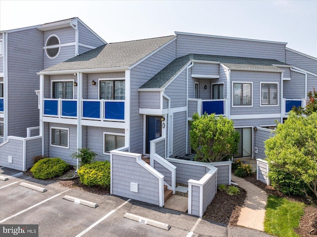 39770 E Sun Dr Unit 125, Fenwick Island, DE 19944 - view of building exterior with uncovered parking
