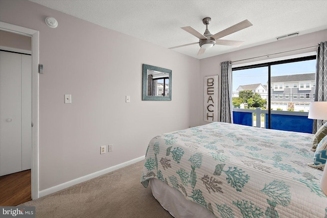 39770 E Sun Dr Unit 125, Fenwick Island, DE 19944 - carpeted bedroom with access to outside, a textured ceiling, and ceiling fan