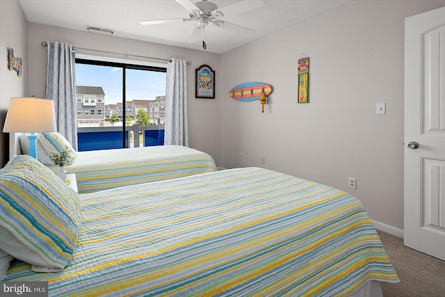 39770 E Sun Dr Unit 125, Fenwick Island, DE 19944 - bedroom featuring carpet, access to exterior, a ceiling fan, and a textured ceiling